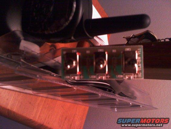 Electronic circuit board with four connectors and visible text 'SG TLA-YTL-05'