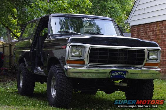 Lifted black 1978 Ford Bronco parked in a yard, front view. Memphis license plate visible