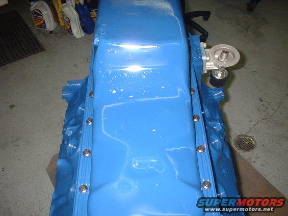 Blue oil pan with filter adapter and Supermotors.net watermark