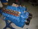 1969 Ford Torino - V8 engine on a stand, valve covers removed to expose internal components.