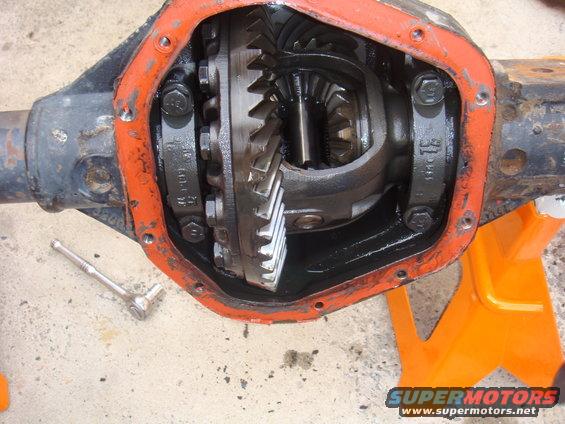 Differential gears with orange gasket and a socket wrench