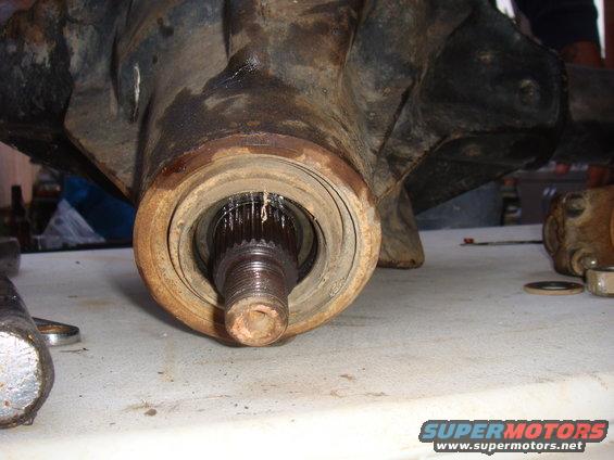 Close-up of a vehicle's front axle hub and spline shaft