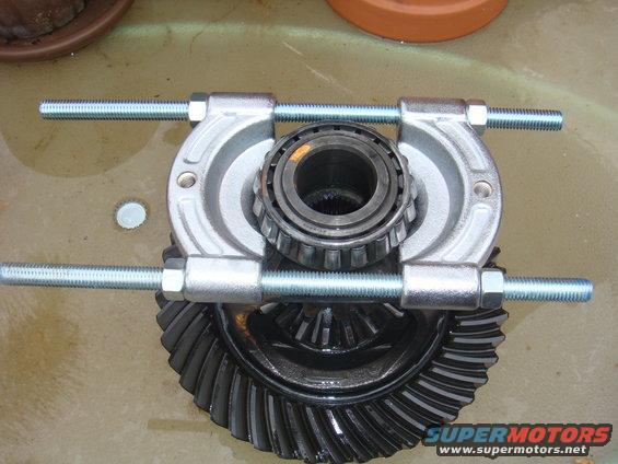 Differential gear with bearing puller tool attached