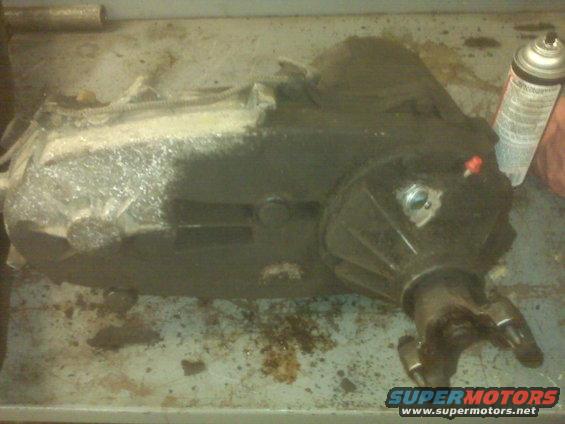 transfer case on a workbench with a can of spray paint
