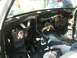 1988 Ford Bronco - The interior of a vehicle is shown with its dashboard removed and wiring exposed.