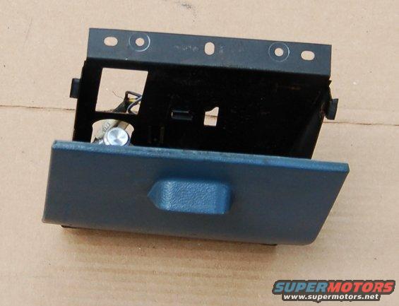 Blue car dashboard ashtray assembly with metal bracket and wiring