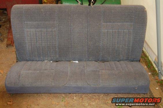 Gray fabric car seat with vertical pleating on the backrest