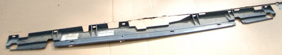 Long gray plastic trim piece with mounting holes and clips