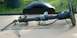 1988 Ford Bronco - A steering column and wheel assembly, likely removed from a vehicle for repair or replacement.
