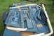 1988 Ford Bronco - Various blue interior door panels and trim pieces are laid out on a trailer.