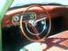 1972 Ford Ranchero - The dashboard and interior of a classic car are shown, a prominent steering wheel and textured seats.
