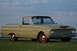 1972 Ford Ranchero - This 1960 Ford Ranchero features a distinctive two-tone paint scheme with red wheels and a tan body.
