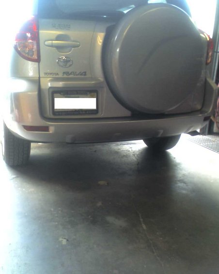 Silver Toyota RAV4 rear with spare tire cover and license plate