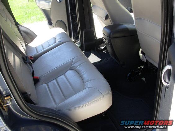 Rear interior of a 2002 Jeep Liberty with light gray leather seats
