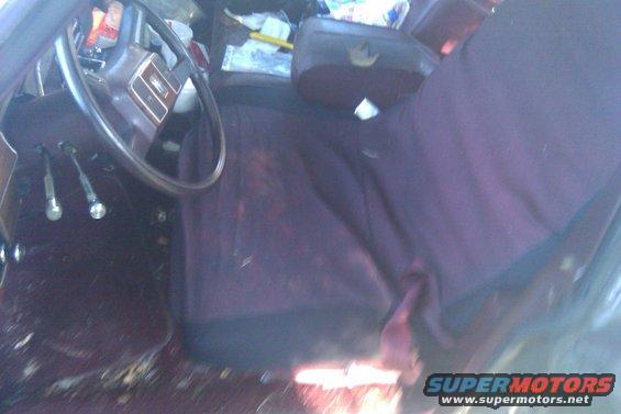 Interior of a car with purple seats and a steering wheel