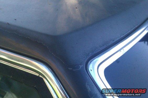 Blue 2000 Mercury Grand Marquis hood detail with chrome trim