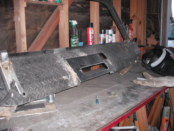 Custom diamond plate bumper part on workbench