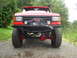 1989 Ford Bronco - This modified truck features a heavy-duty bumper and winch, with a snorkel and ARB visor.
