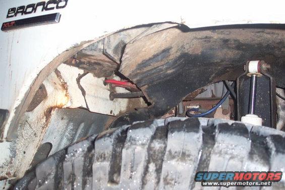 innerfender1.jpg Passenger inner fender hacked; you can also see a good place to come thru the firewall here