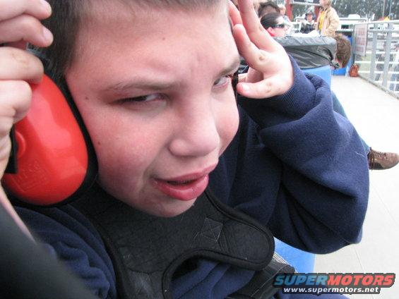 Joe was startled by the noise of the Monster Trucks.