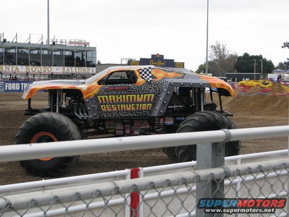 Monster truck with "Maximum Destruction" text, orange and grey paint scheme