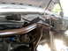 1996 Ford Bronco - Custom suspension components are installed in the engine bay of a white vehicle.
