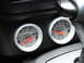 2003 Mercury Marauder - Close-up of two Auto Meter gauges, an oil pressure gauge and a voltage gauge, mounted on a vehicle's dashboard.