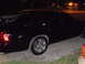 2003 Mercury Marauder - A black sedan is parked outside at night, with another vehicle visible in the background.