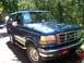 1995 Ford Bronco - This 1995 Ford Bronco is shown from a three-quarter front view, parked in a driveway.