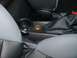 2003 Ford Crown Victoria - Interior view of a car's center console, a cup holder and gear shift area.