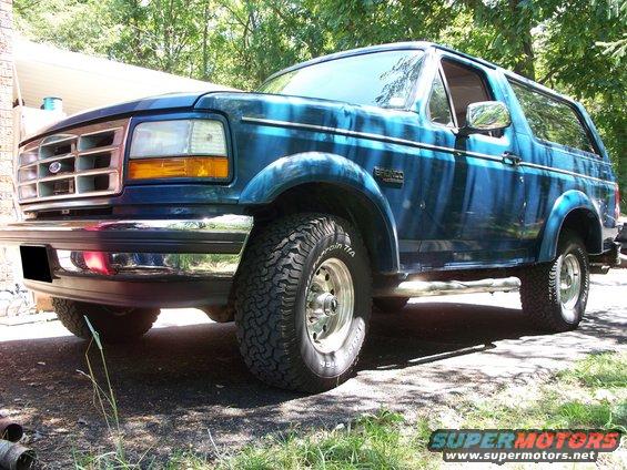 Blue 1995 Ford Bronco parked outside on a sunny day