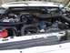 1995 Ford C-350 (Centurion Conversions) - Close-up view of the engine compartment, showing various mechanical parts and wiring.