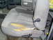 1996 Dodge 2500 - The driver's seat upholstery is significantly damaged, revealing the foam underneath.