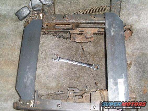 Seat frame mechanism with wrench on carpet