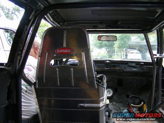 Interior of a race car with a Kirkey racing seat and roll cage
