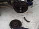1989 Ford Escort - The brake drum and assembly are shown removed from the vehicle, with a piece of the drum broken off.