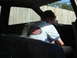 1989 Ford Escort - Interior view of a vehicle with a child seated in the back.