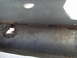1989 Ford Escort - Detail of rusted metal, possibly from a vehicle's undercarriage, showing significant corrosion and a hole.