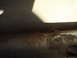 1989 Ford Escort - Close-up view of corroded metal frame, likely part of a vehicle's undercarriage.