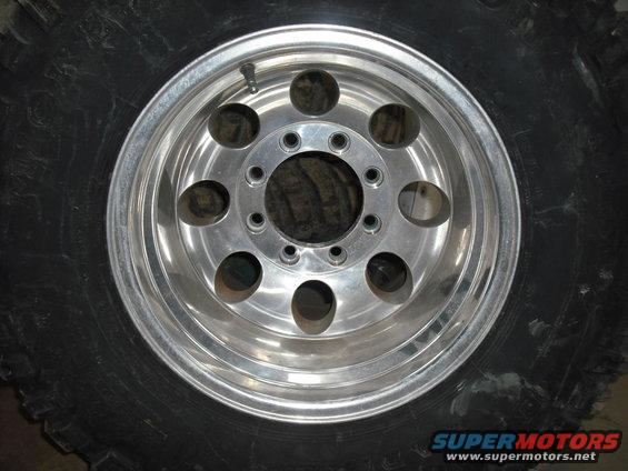 Aluminum alloy wheel with eight lug holes and a large tire