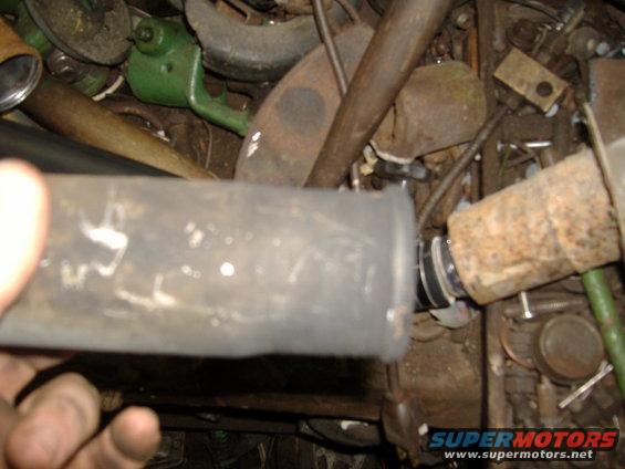 Exhaust pipe section with rust and a clamp