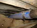 1995 Ford F-150 - Close-up view of a blue silicone hose secured with a clamp, part of the vehicle's repair.