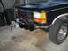 1991 Ford Explorer - Front view of a 1991 Ford Explorer with an aftermarket winch mounted on the bumper.
