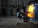1991 Ford Explorer - A winch is mounted to the rear of a vehicle, with trash cans visible behind it.