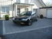 2003 Audi A6 - A black 2003 Audi A6 Avant is parked in front of a modern house.
