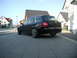 2003 Audi A6 - A black 2003 Audi A6 wagon is parked in front of a modern house on a sunny day.