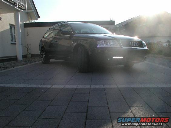 Black 2003 Audi A6 Avant parked on a paved driveway, front 3/4 view