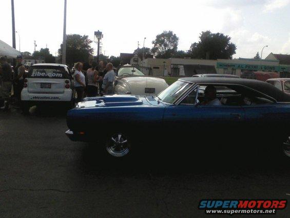 Blue coupe with hood scoop, side view. 1969 model