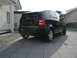 2001 Audi A4 - A black Audi A2 hatchback is parked on a paved driveway in front of a house.