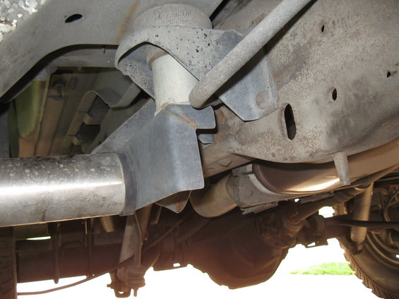 Underside view of vehicle frame, suspension, and exhaust system